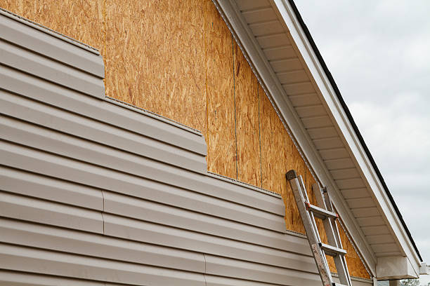 Professional Emergency Siding Repair technician working in Riverside, NY